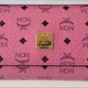 In fair condition. MCM long wallet logo total pattern pink leather & gold logo.